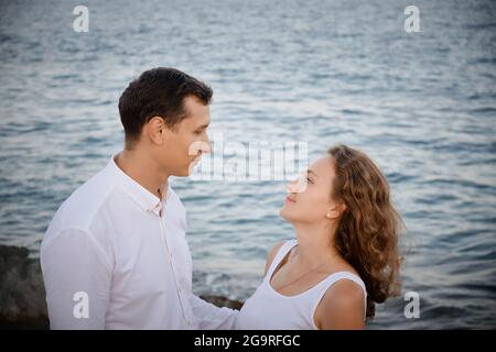 Man and woman look to each other Stock Photo