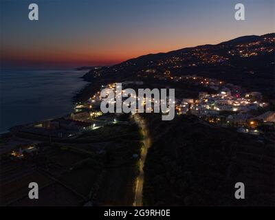 La Caleta, village in spain in a red sun set at the ocean Stock Photo