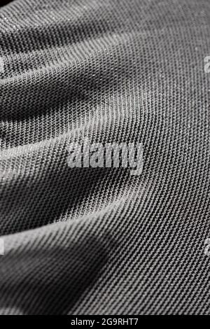 Texture of a fine white mesh on black background. Stock Photo