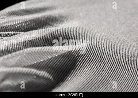 Texture of a fine white mesh on black background. Stock Photo
