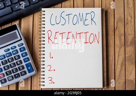 Text caption presenting Customer Retention. Business concept activities companies take to reduce user defections Blank Open Spiral Notebook With Stock Photo
