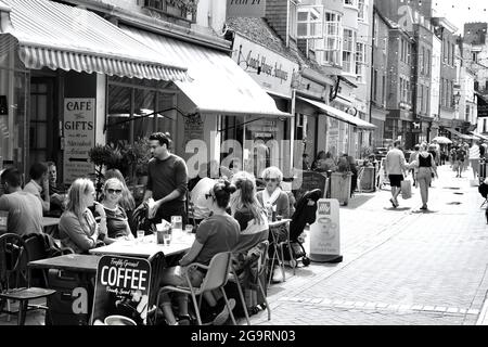 Hastings, Sussex, England July 04 2021: The weather is good and tourists enjoy eating al fresco in the streets of the old town in East Hill, Hastings Stock Photo