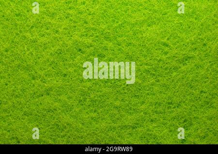 Textile. Background from green material. Enlarged spongy fibers. Sponge texture. Close up Stock Photo