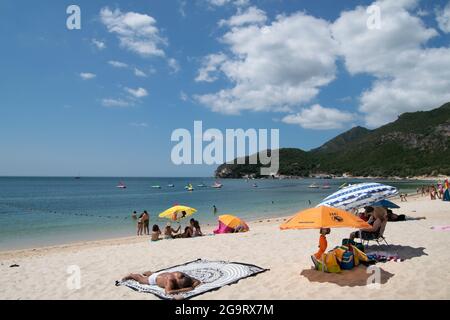 Hollydays at Creiro beach in Arrábida, Setúbal at Portugal European country. Arrábida Natural Park. Spending time at the beach. Summer beach playa. Stock Photo