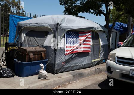 Los Angeles, CA USA - Julyl 3, 2021: Tent of a homeless veteran living outside the Veterans Administration hospital and grounds Stock Photo