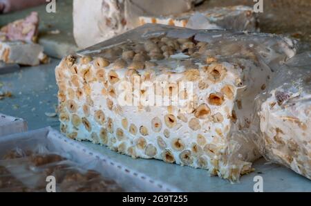 close-up shot of the classic nougat with hazelnut almonds and Italian honey from the Sardinian region Stock Photo