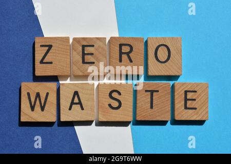 Zero Waste, words in wooden alphabet letters isolated on blue and white background Stock Photo