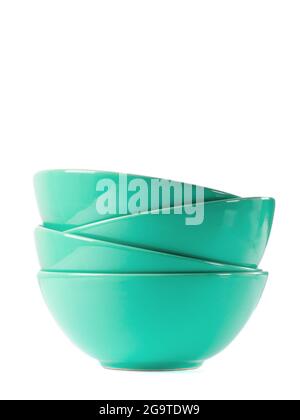 Stack of four green ceramic bowls isolated on white. Stock Photo