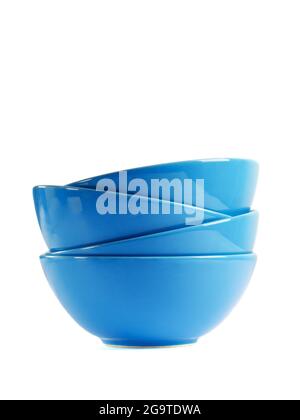 Stack of four blue ceramic bowls isolated on white. Stock Photo