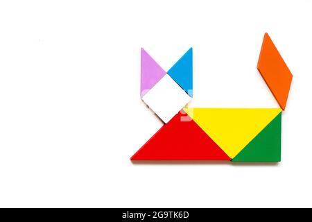 Color wood tangram puzzle in cat shape on white background Stock Photo