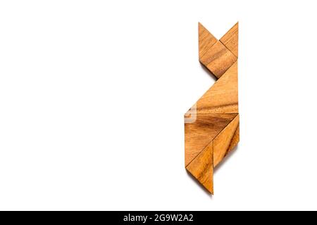 Wood tangram puzzle in cat sitting shape on white background Stock Photo