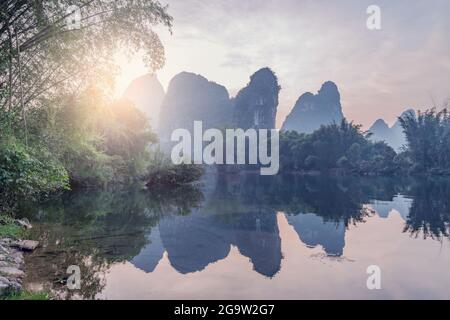 Sunset view of karst hills by Yulong River. Yangshuo. Guangxi Province. China. Stock Photo