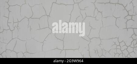 Old grey wall with cracks. Detailed background with beautiful abstract pattern on aged cement wall. Stock Photo