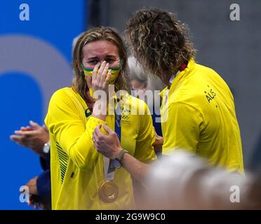 Australia's Ariarne Titmus (left) celebrates her gold medal in the Women's 200m freestyle at Tokyo Aquatics Centre on the fifth day of the Tokyo 2020 Olympic Games in Japan. Picture date: Wednesday July 28, 2021. Stock Photo