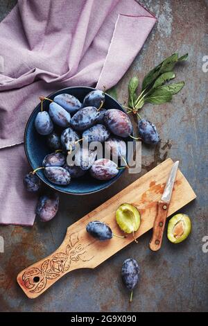 Freshly picked plums in a bowl. Jam making. Stock Photo