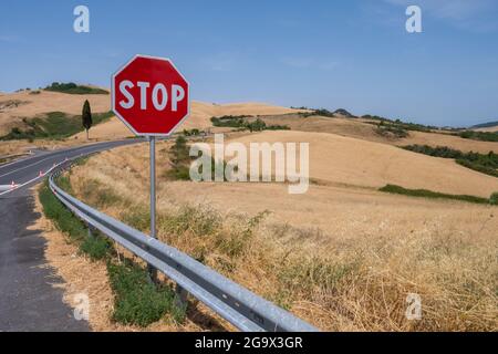 Stop road sign on hill of Tuscany Italy Stock Photo