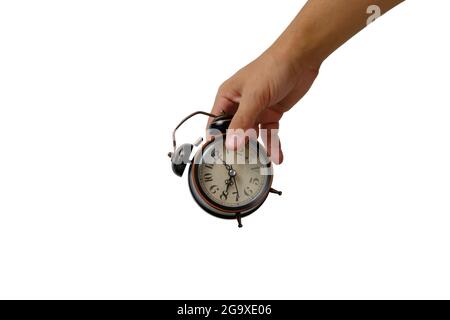 Old retro alarm clock in your hand white background of isolate.Eight clock morning Stock Photo