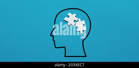 Human head icon with puzzle pieces. Human psychology or mental health or illness concept. Stock Photo