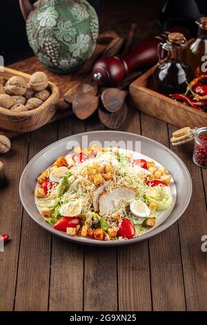 Plate of caesar salad with chicken and lettuce Stock Photo
