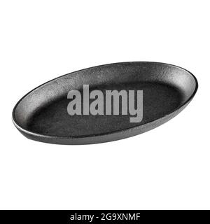 Isolated black cast iron handleless frying pan Stock Photo