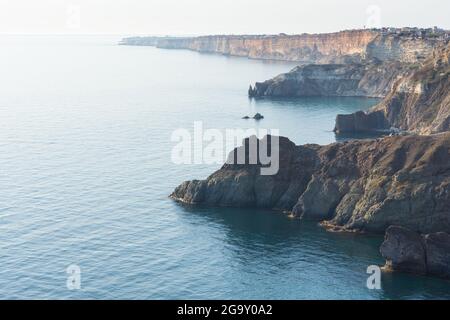 Fiolent Sevastopol Crimea on April 18, 2020. Beautiful aerial atmospheric landscape with the sea and rocks. The smooth surface of the sea in a blue ha Stock Photo