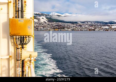 Village of Volda from a boat in Norway during winter Stock Photo