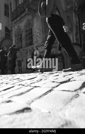 ISTANBUL, TURKEY - Mar 07, 2020: A shallow focus of a man walking on the streets of Taksim in Istanbul, Turkey in grayscale Stock Photo