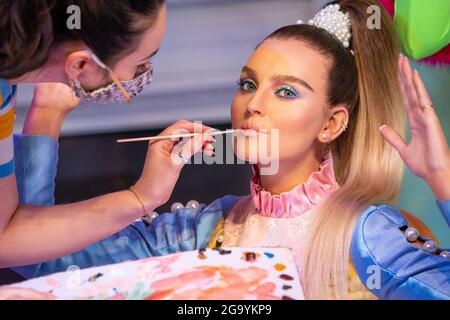 A staff member put the finishing touches to the wax figure of Perrie Edwards as Little Mix are unveiled at Madame Tussauds London. Picture date: Wednesday July 28, 2021. Stock Photo