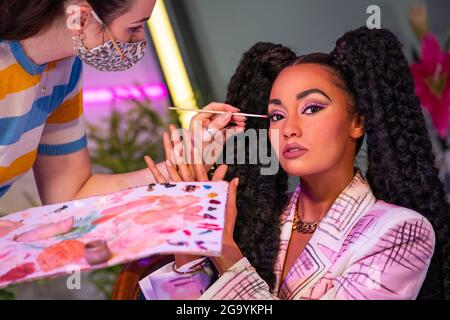 A staff member put the finishing touches to the wax figure of Leigh-Anne Pinnock as Little Mix are unveiled at Madame Tussauds London. Picture date: Wednesday July 28, 2021. Stock Photo