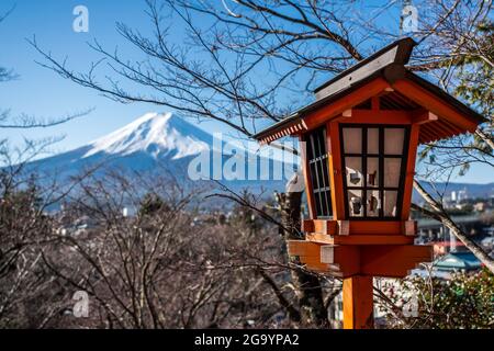 Mt Fuji View with a Red Toro Japanese Wooden Lantern in Arakurayama Sengen Park, Japan. Stock Photo