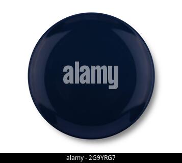 Dark blue ceramic plate isolated on white background. Top view Stock Photo