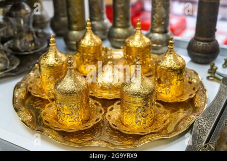 https://l450v.alamy.com/450v/2g9yrx9/turkish-oriental-traditional-antique-gold-decorated-ethnic-coffee-cups-and-decorative-gift-cups-with-a-cap-on-arabic-style-2g9yrx9.jpg