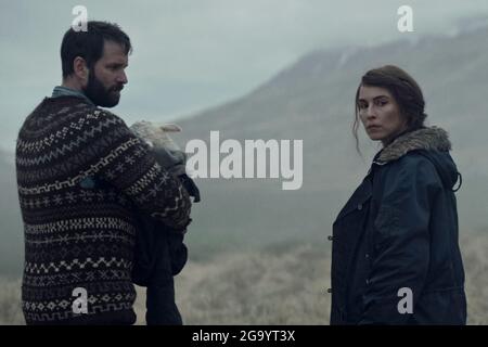 Lamb (2021) directed by Valdimar Jóhannsson and starring Noomi Rapace, Ingvar Sigurdsson and Björn Hlynur Haraldsson. Icelandic supernatural horror about a childless couple find a mysterious new born on their sheep farm in Iceland which brings them much joy to begin with…. Stock Photo