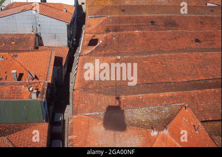 14.06.2018, Porto, Portugal, Europe - View from Teleferico de Gaia cable car gondola of old buildings with tiled roofs of former winery warehouses. Stock Photo