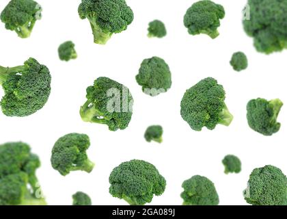 Falling broccoli isolated on a white background. Flying broccoli. Vegetable pattern for packaging design. Healthy food concept. Stock Photo