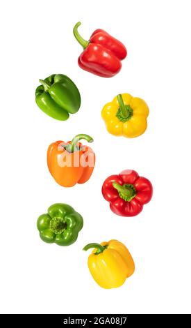 Falling peppers isolated on a white background. Flying colorful bell pepper pattern. Design for packaging. Vegetable flight. Stock Photo