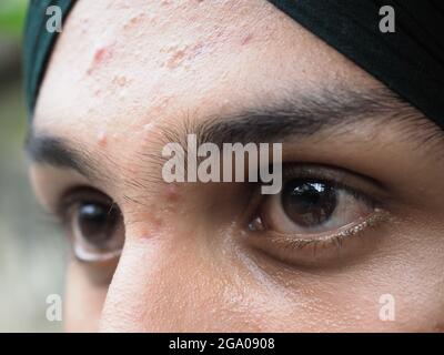 Macro shot of punjabi boy black eye Close-up portrait of a punjabi boy with black eyes Stock Photo