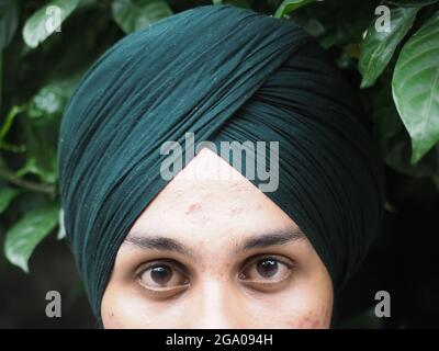 Macro shot of punjabi boy black eye Close-up portrait of a punjabi boy with black eyes Stock Photo