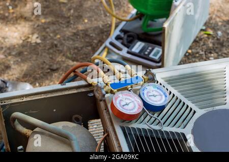 Air conditioning heating units for a is checking conditioning system outdoor residential house Stock Photo