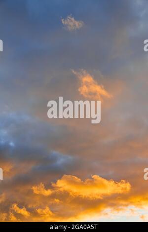 Clouds with orange sunset light Stock Photo