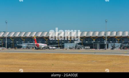 MADRID, SPAIN - Jul 16, 2021: An Iberia Airline on the runway of tarmac at Madrid-Barajas Adolfo Suarez Airport in Spain Stock Photo