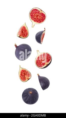 Falling figs isolated on a white background. Flying fruits for packaging design. Flying down figs. Healthy natural food. Stock Photo