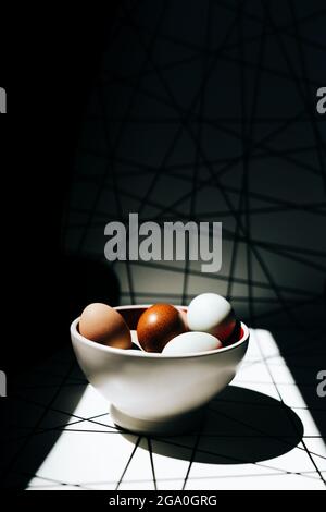 Wide view of a bowl of eggs on a patterned background Stock Photo