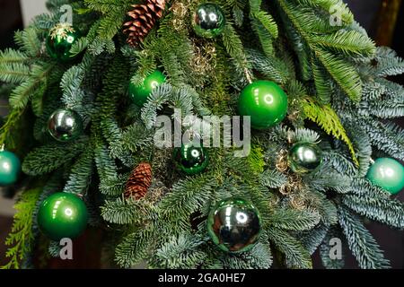 Close-up view of beautiful christmas tree with colorful baubles Stock Photo