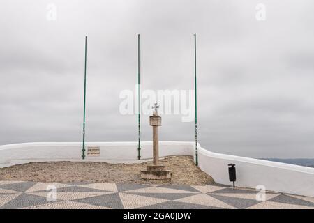 Nazare, Portugal - June 30, 2021: Cross next to the Memory Hermitage on the Miradoura do Suberco viewpoint