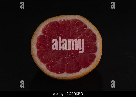 red grapefruit on black background Stock Photo