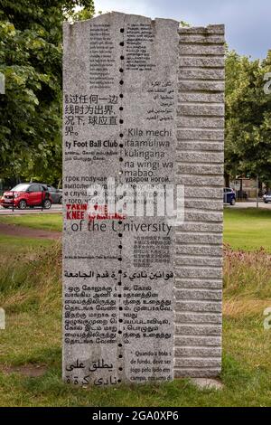 CAMBRIDGE ENGLAND PARKERS PIECE FIELDS THE CAMBRIDGE RULES FOOTBALL MONUMENT AND MESSAGE TAKING THE KNEE IS ACCEPTABLE Stock Photo