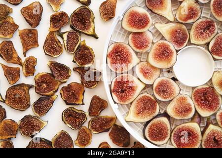 Sliced fresh and dried figs lie on the table Stock Photo