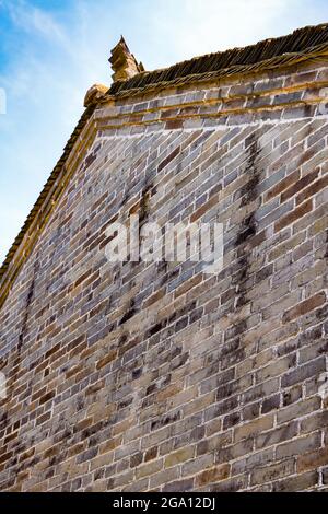 An exterior wall and roof of an ancient Chinese masonry building Stock Photo