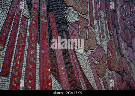 Detail of decorative textured mosaic from old building facade Stock Photo
